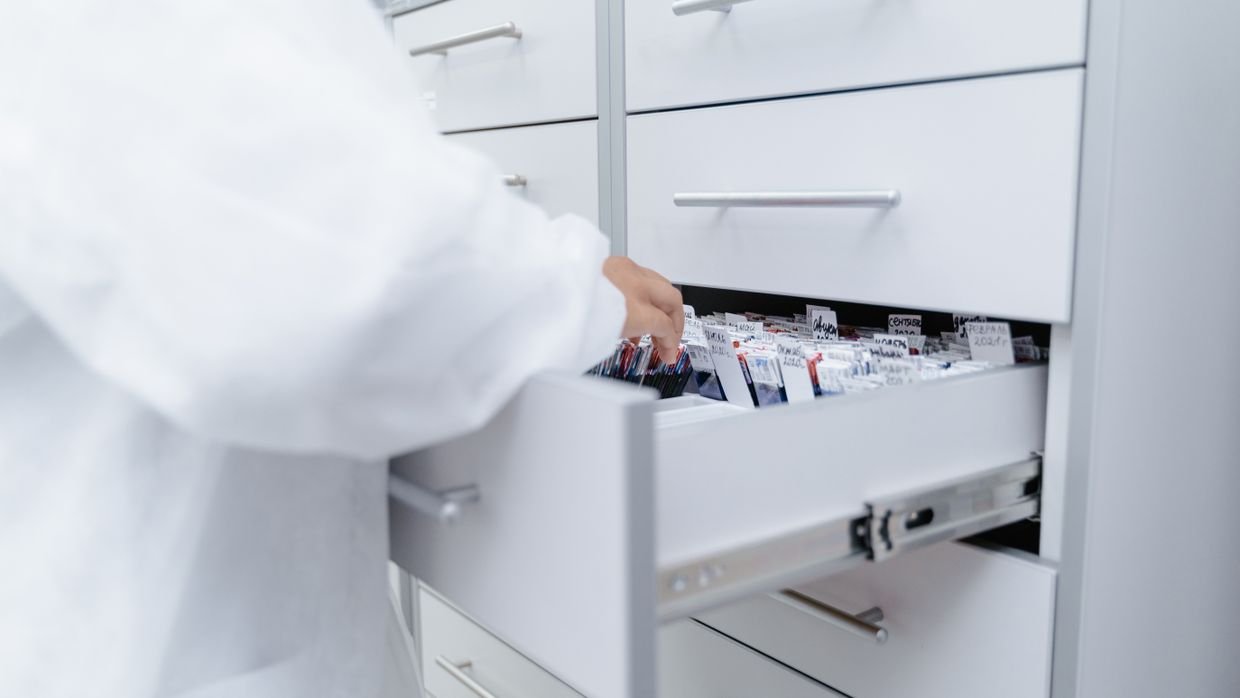 A filing cabinet with drawers pulled open.