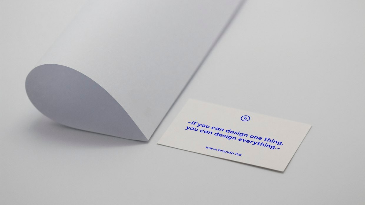 A long printed document unrolled on a table.