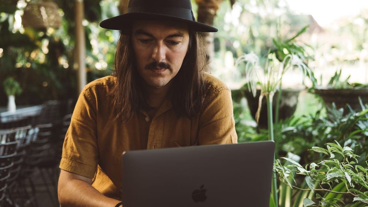 A creator adjusting settings on a laptop, where automatic chapters are switched off.