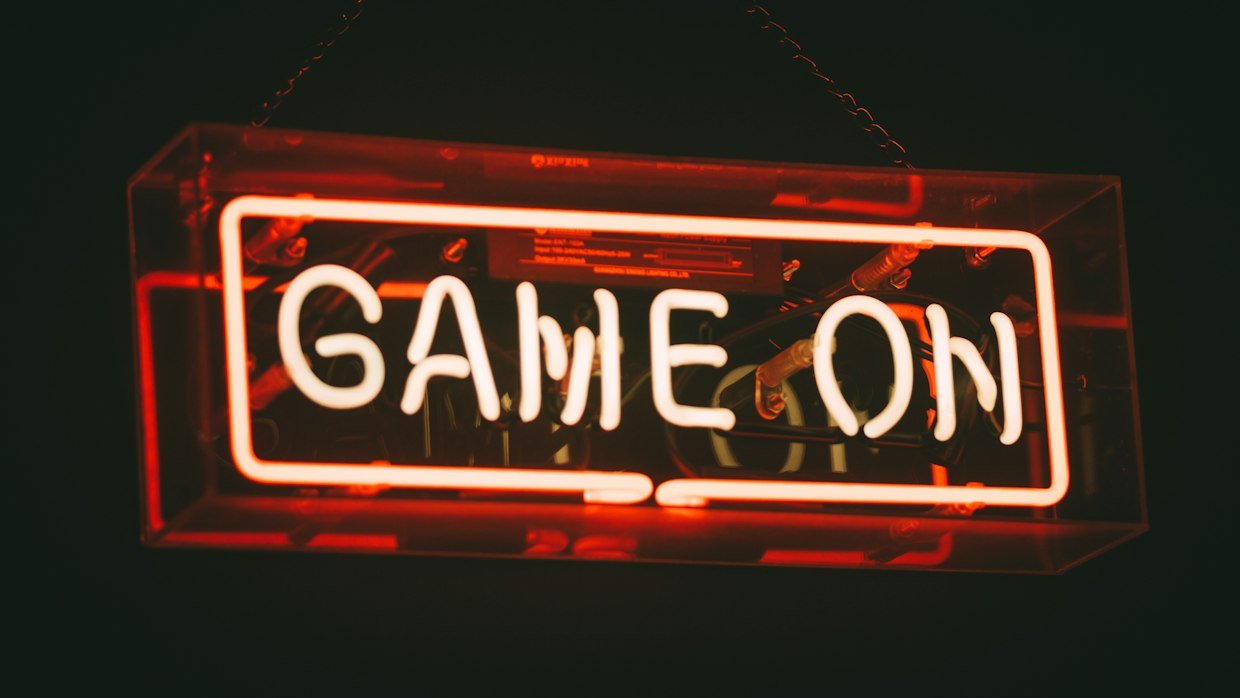A glowing neon sign at night.