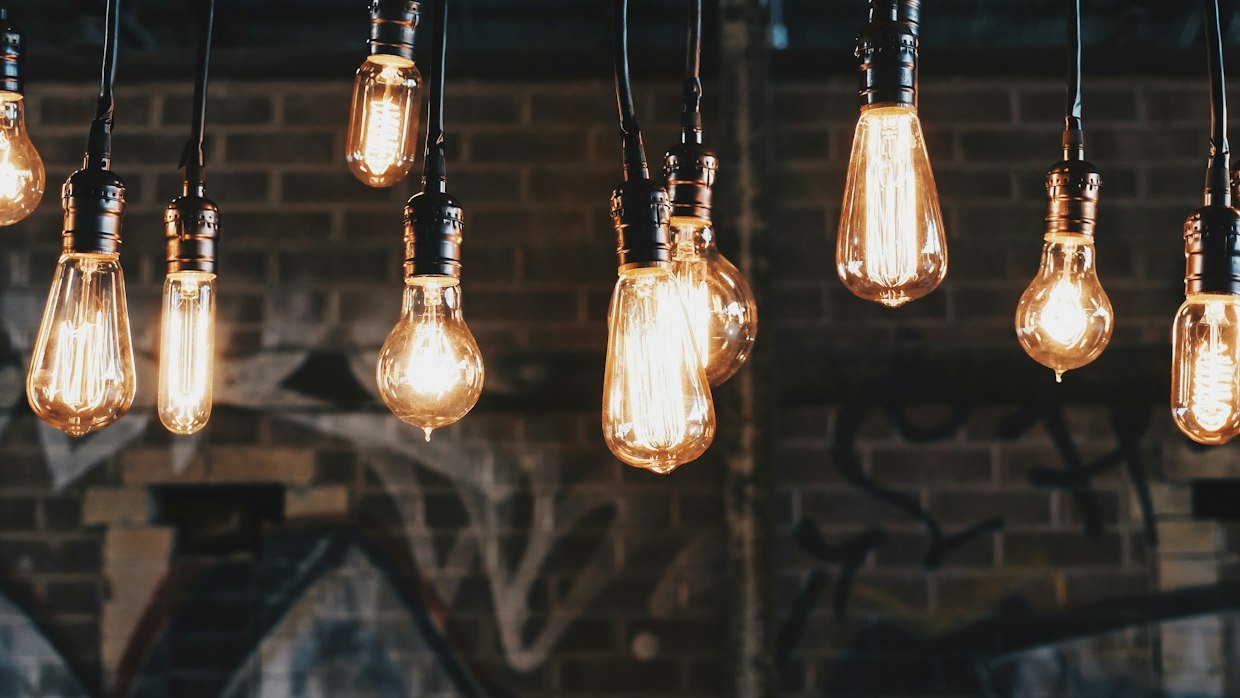 A row of identical light bulbs.