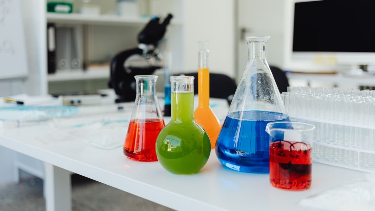Beakers lined up on a laboratory bench.