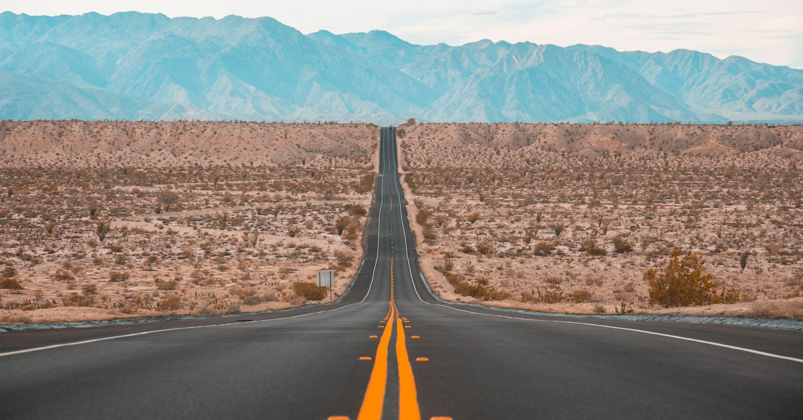 A long road running to the horizon.