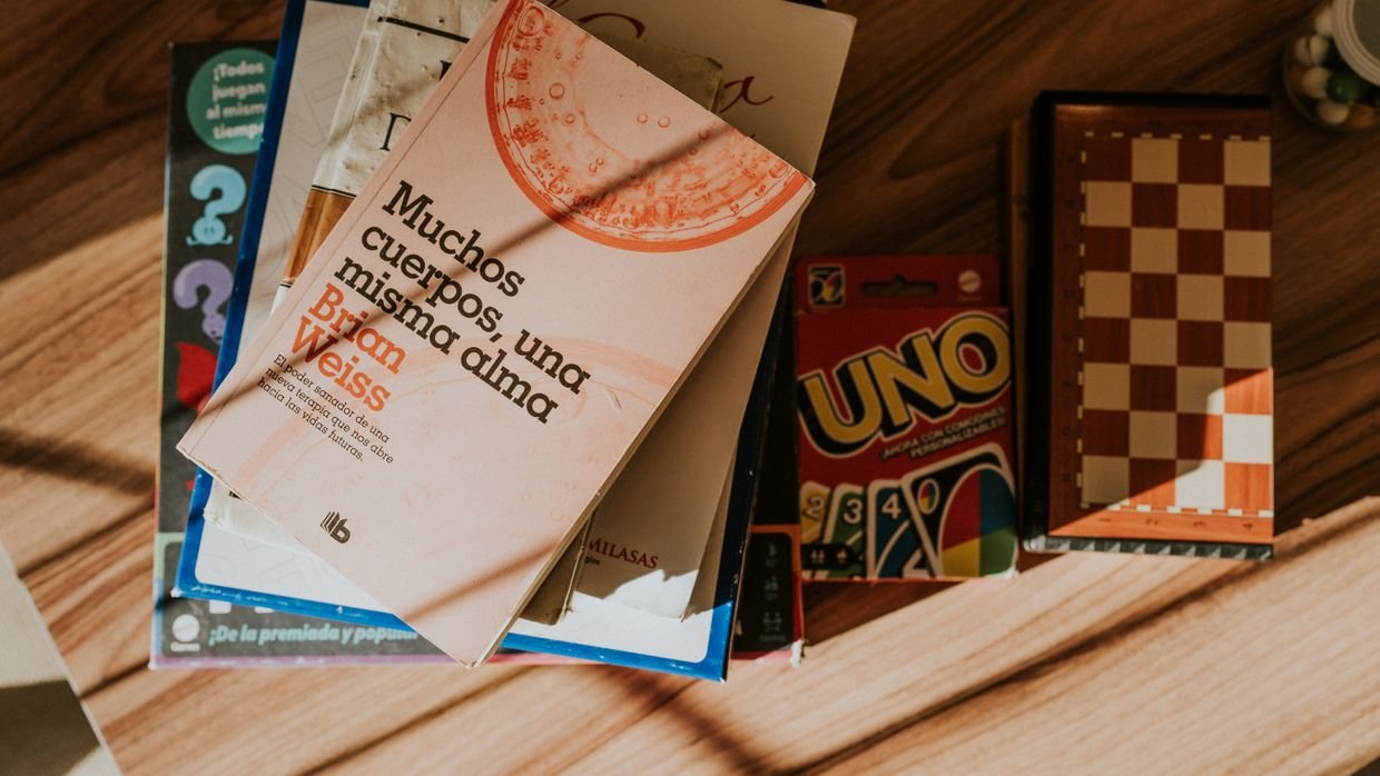 A small index card next to a thick book.