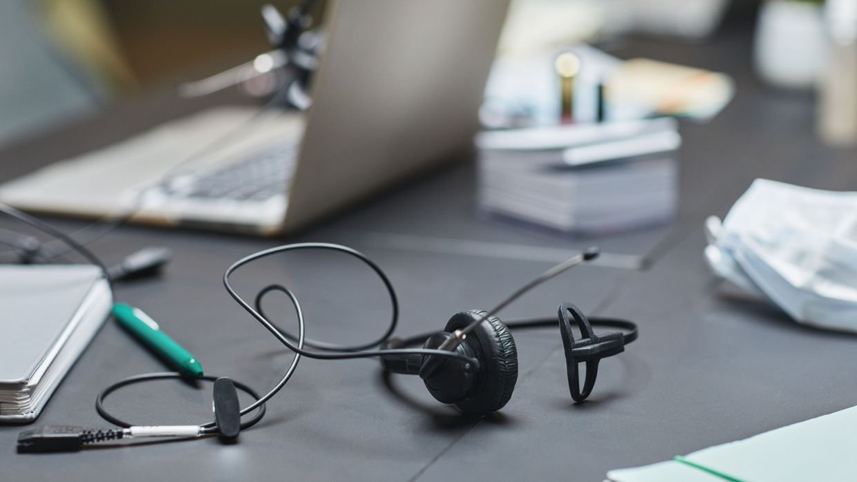 A closed notebook beside a microphone.
