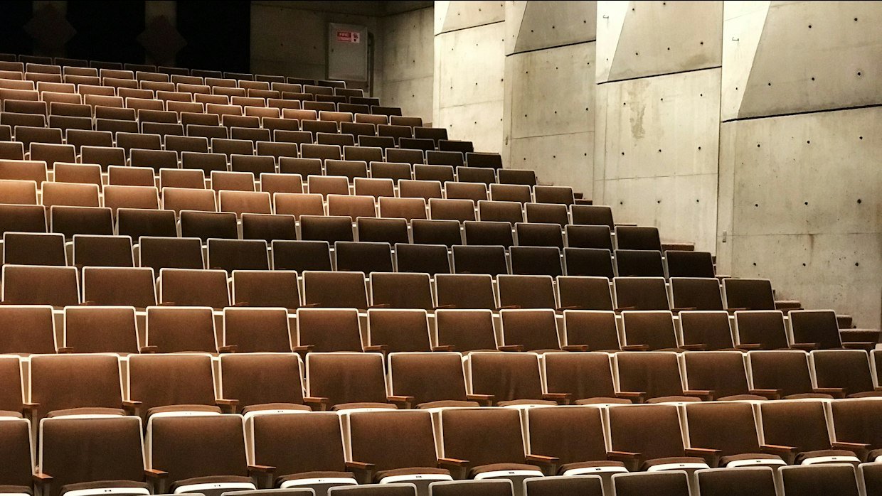 Rows of empty seats in a lecture theatre.