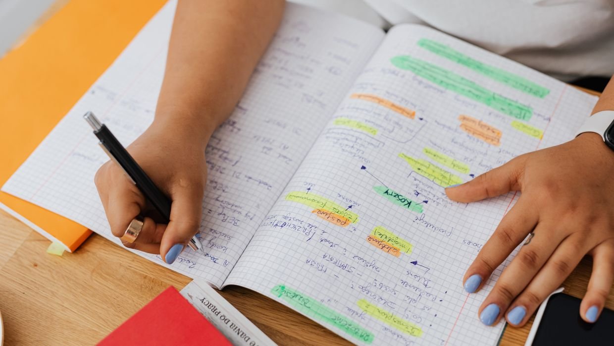 Highlighted revision notes spread out for study.