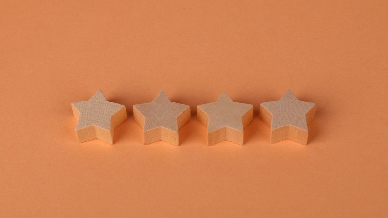 Four wooden blocks lined up in a row.