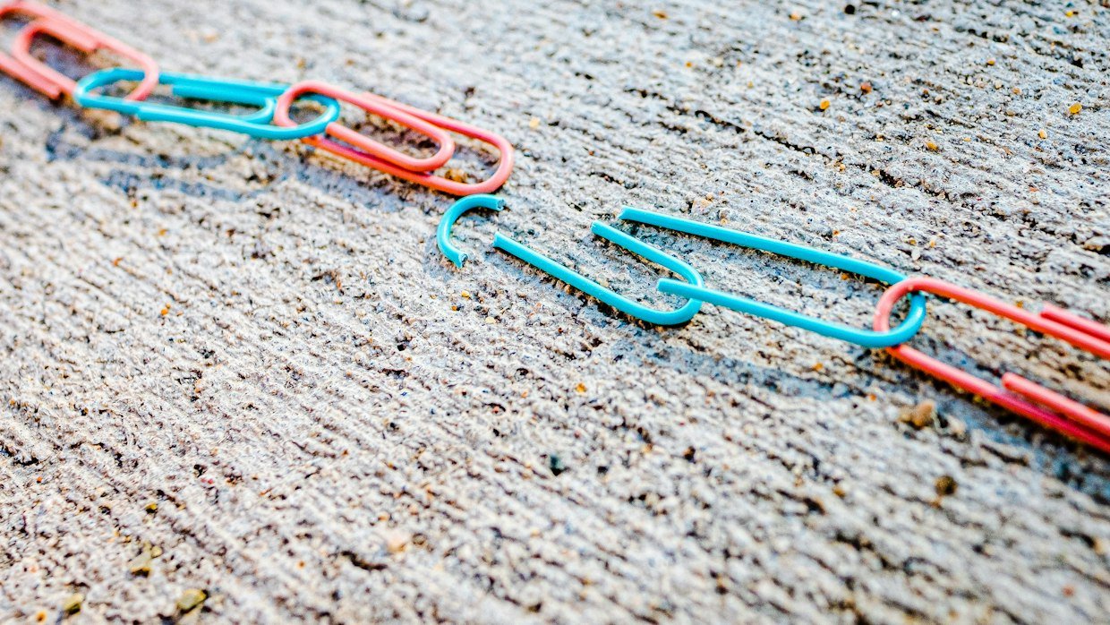 A chain with one link broken open.