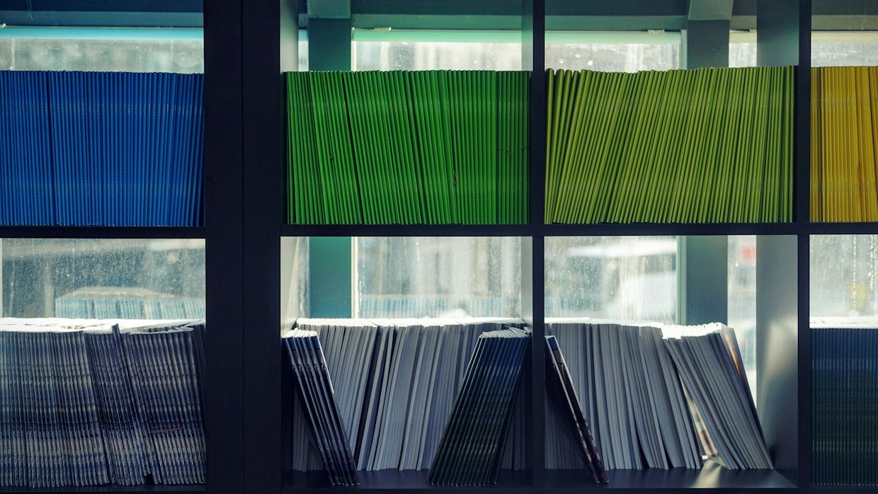 Coloured index tabs separating pages in a folder.