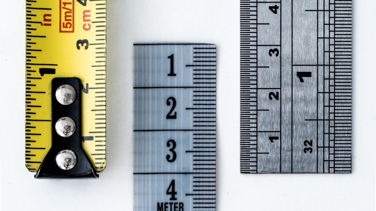A measuring tape extended across a surface.