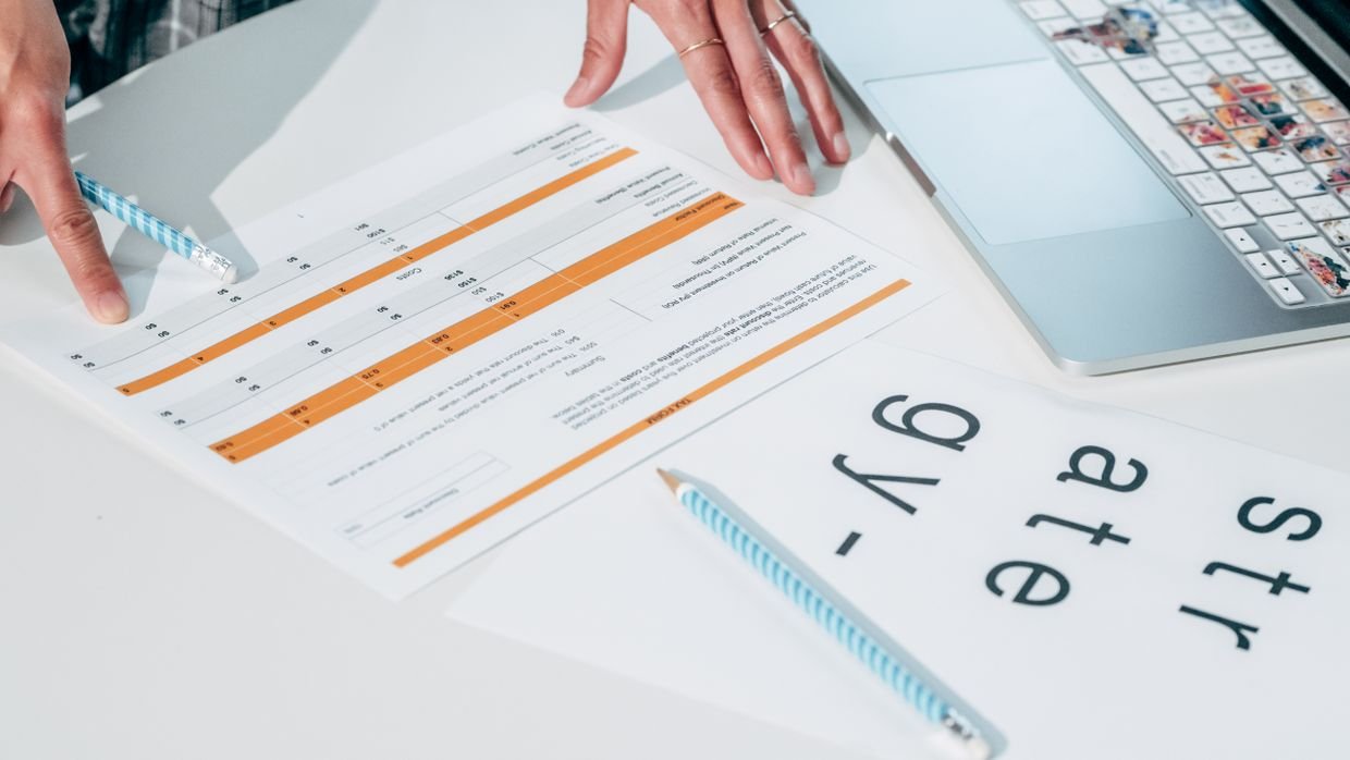 A printed data table lying on a desk.