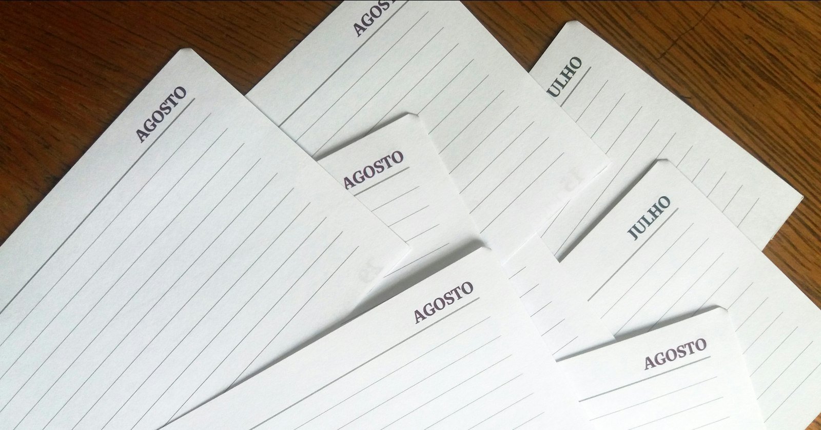 Revision notes and flashcards spread across a desk.