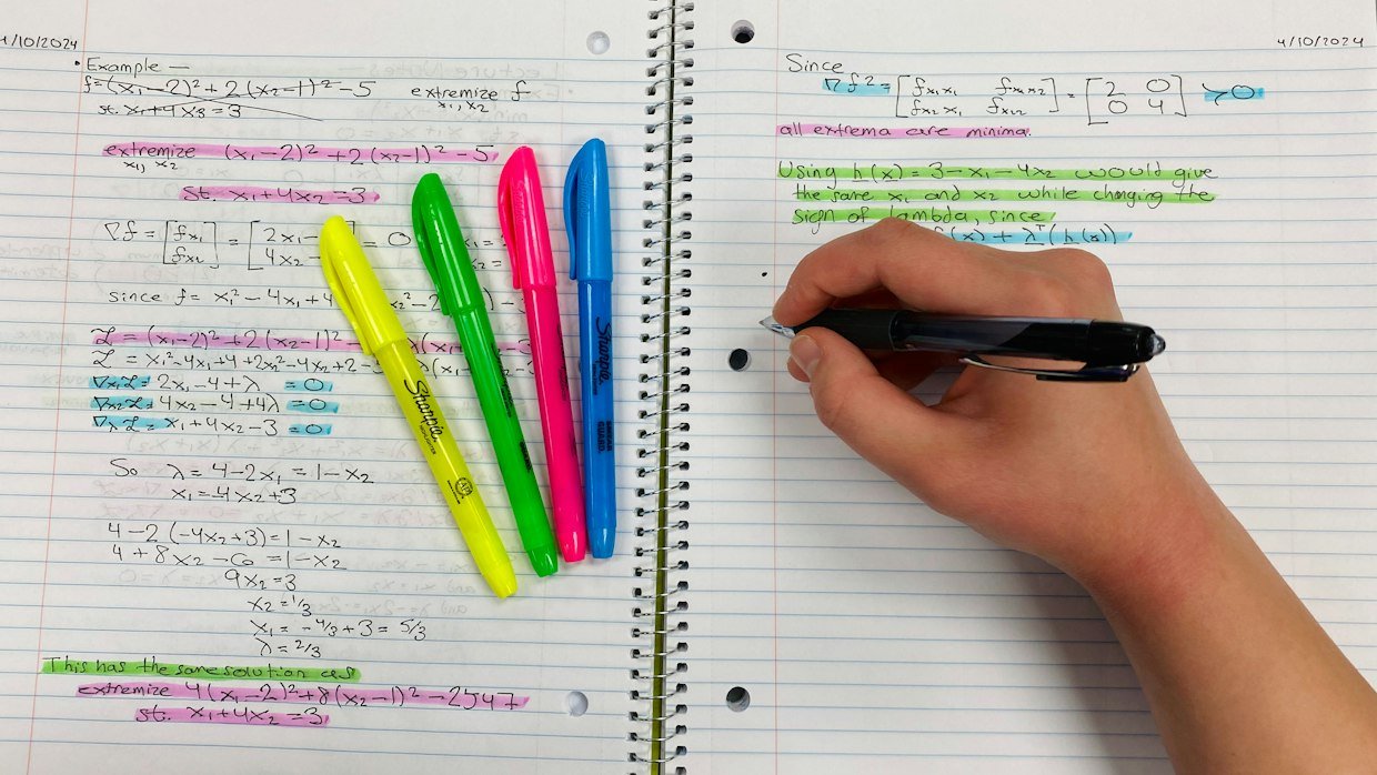 A textbook page marked up with highlighter and margin notes.