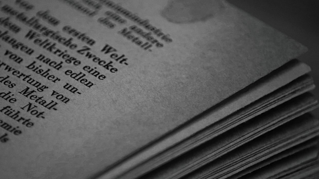 A tall stack of densely printed pages.