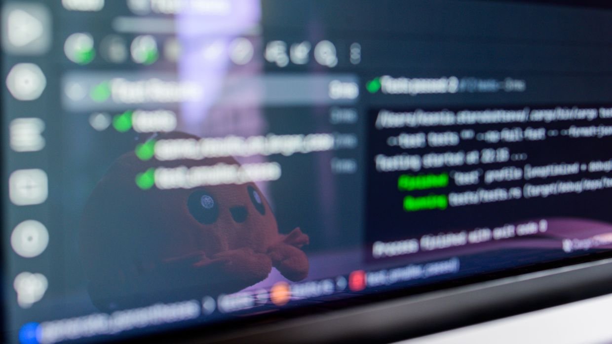 A developer looking at code on a screen, for the open bug report about Leo and YouTube.