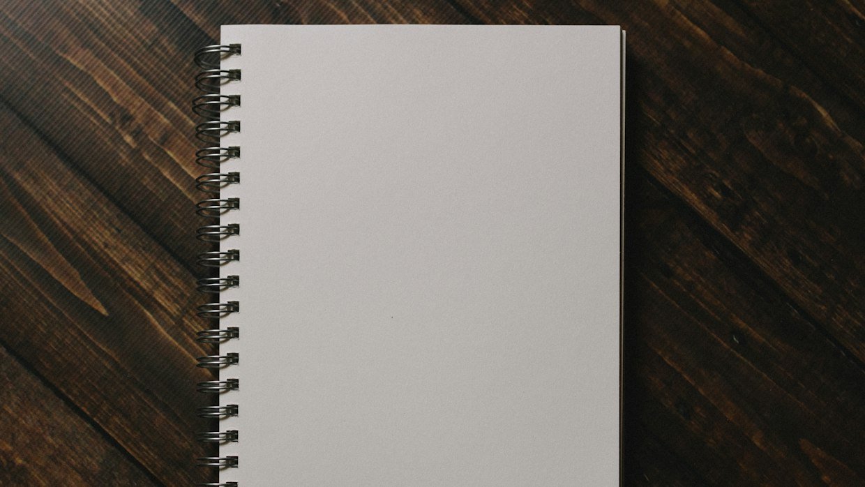 A blank page in an open notebook.