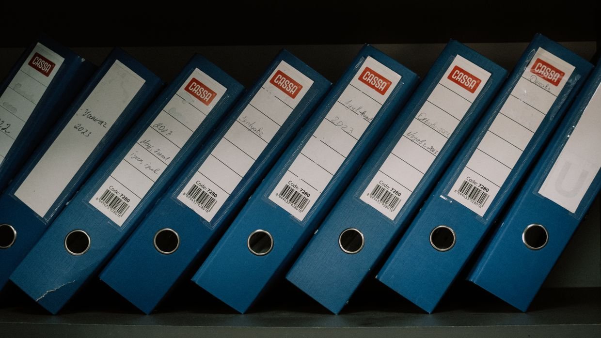 Labelled dividers separating sections in a folder.