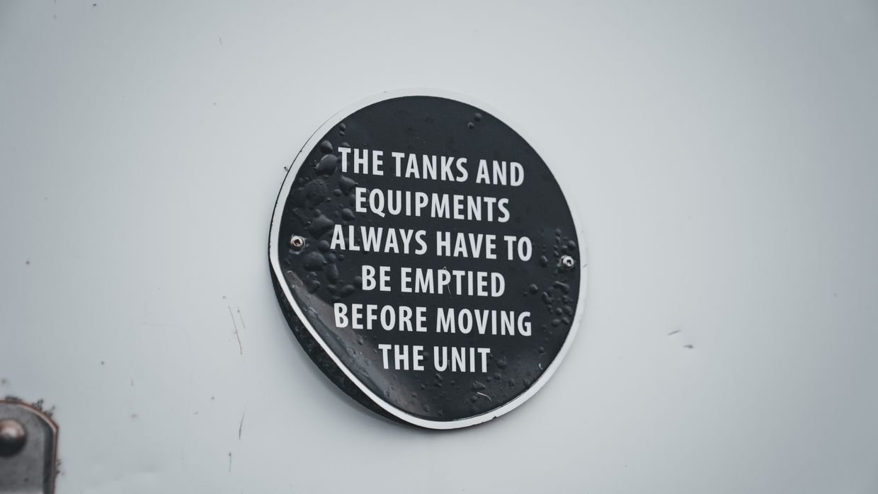 A warning sign attached to industrial equipment.
