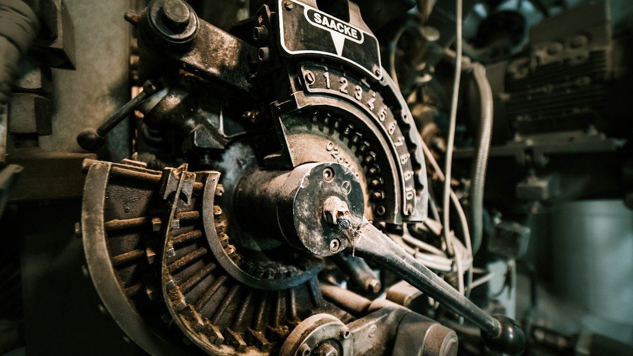 A torque wrench resting on a machine.