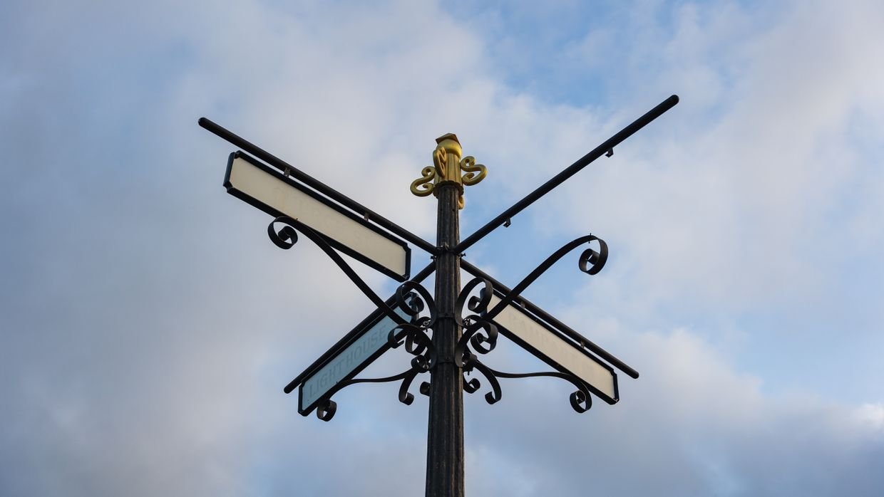 A signpost pointing in two directions.