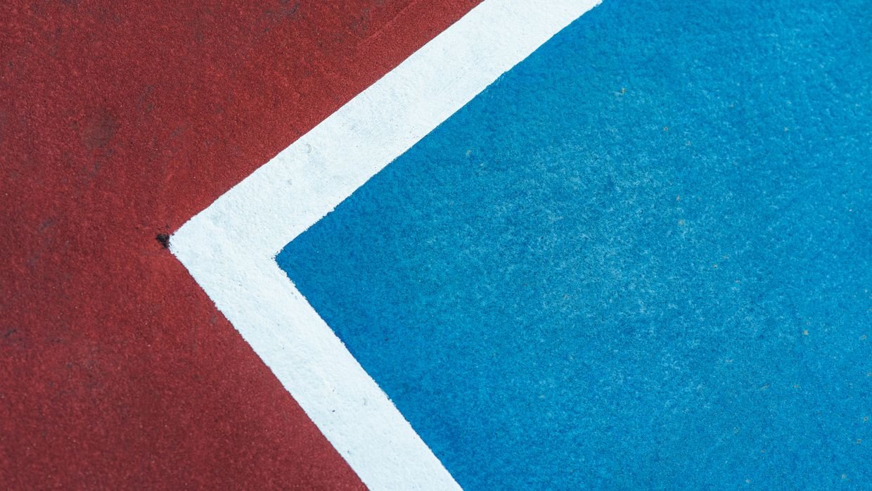 A painted boundary line on the ground.