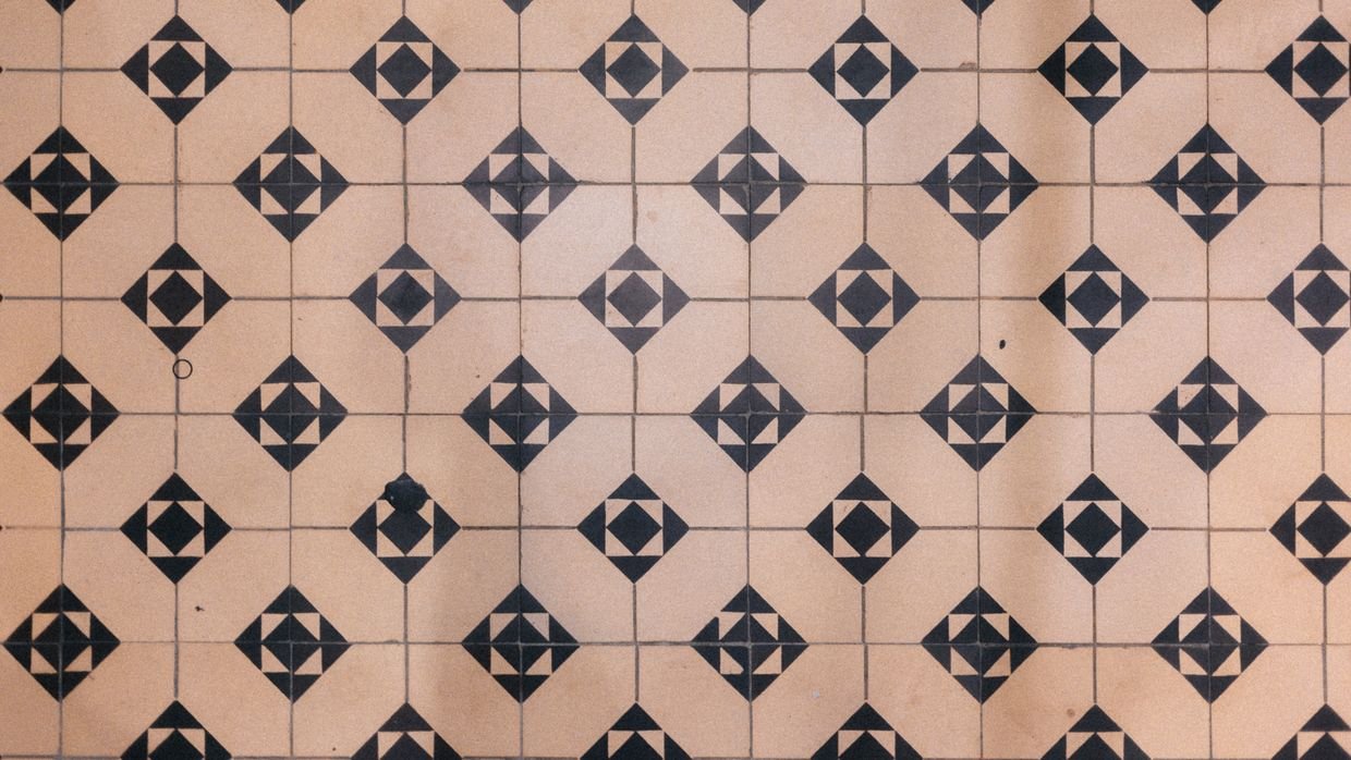 A repeating pattern of floor tiles.