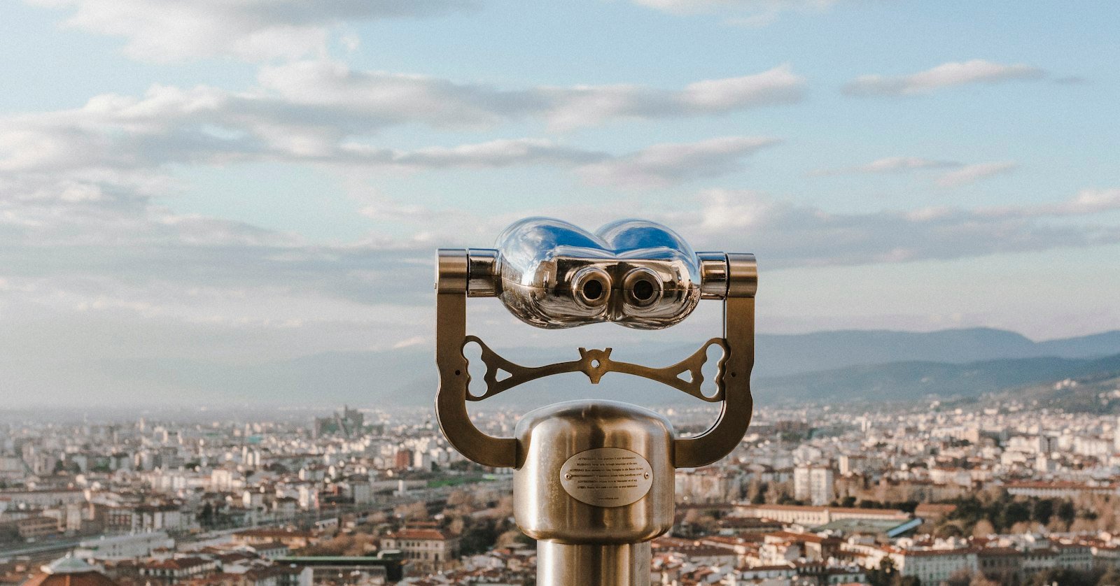 Binoculars resting on an open map.