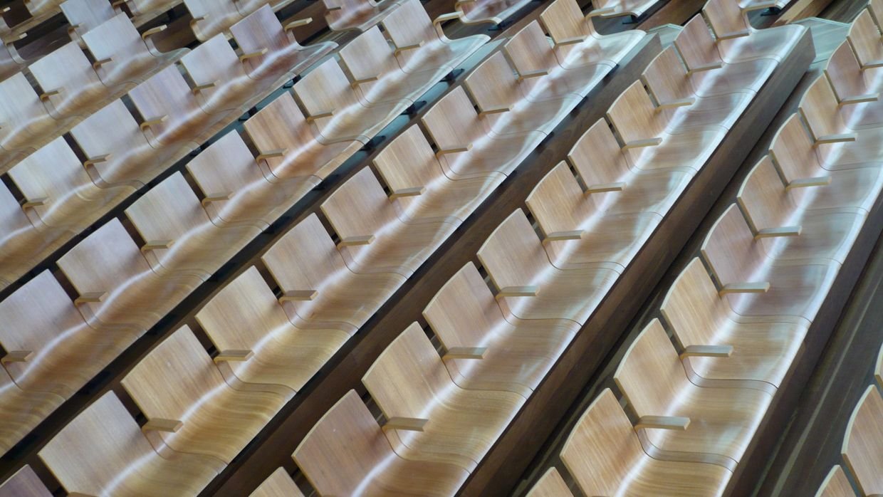 Empty seats in a lecture hall.