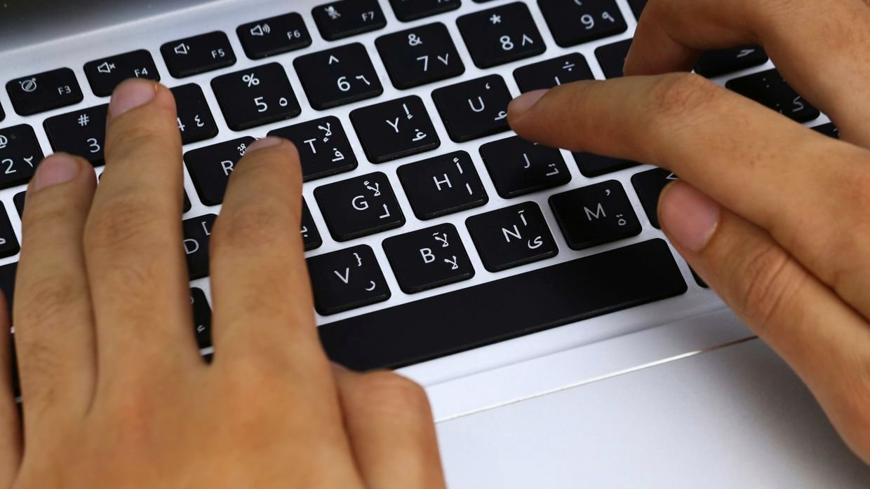 A close-up of typing on a laptop keyboard, as when asking Copilot a specific question.