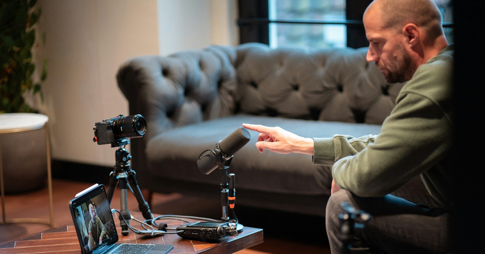 A camera set up for filming in a home studio.