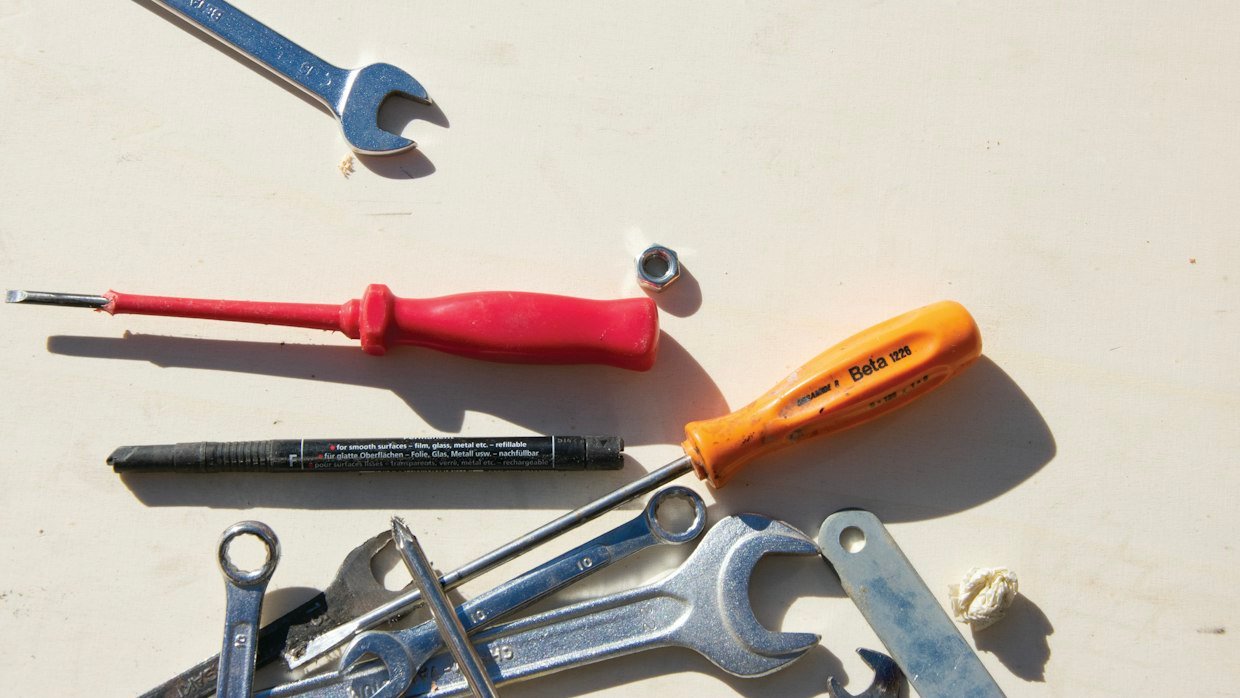 Several similar tools laid out in a row.