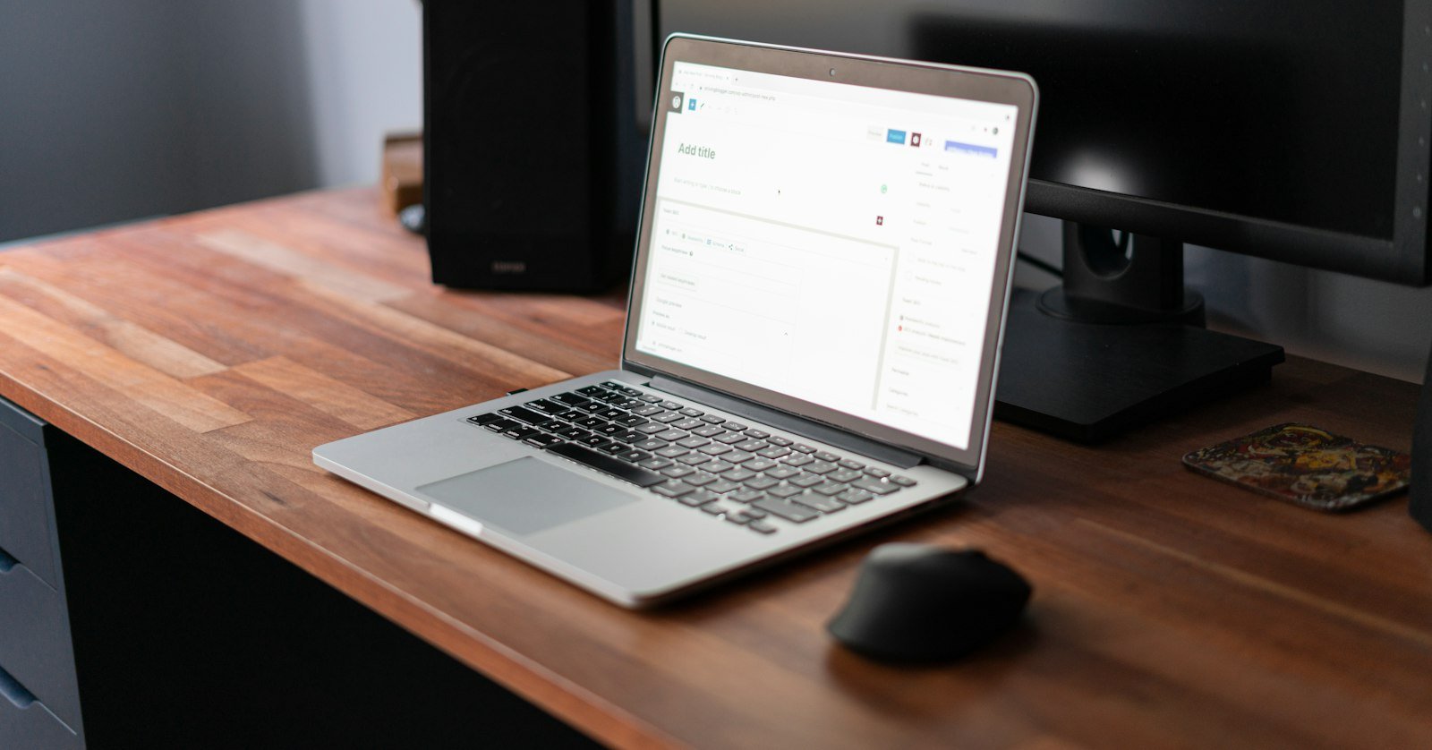 A laptop displaying software on a desk.