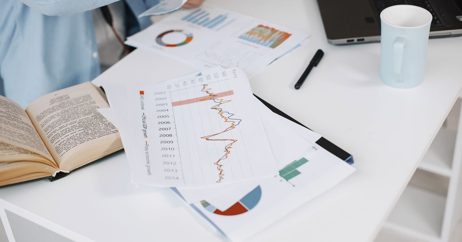 A printed financial report open on a desk.