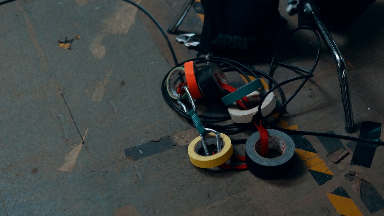 A measuring tape extended along a floor.