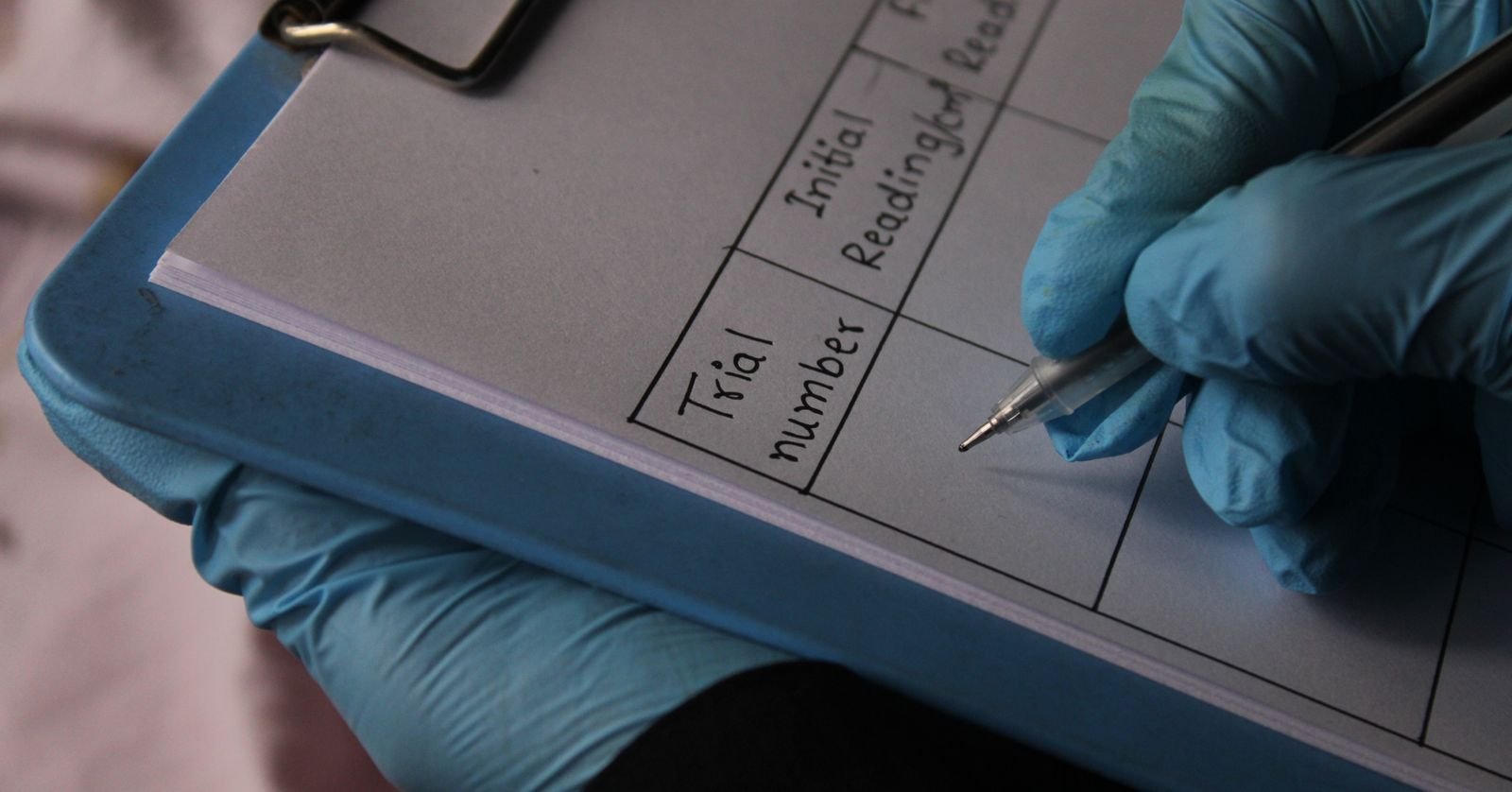 A laboratory notebook filled with handwritten results.