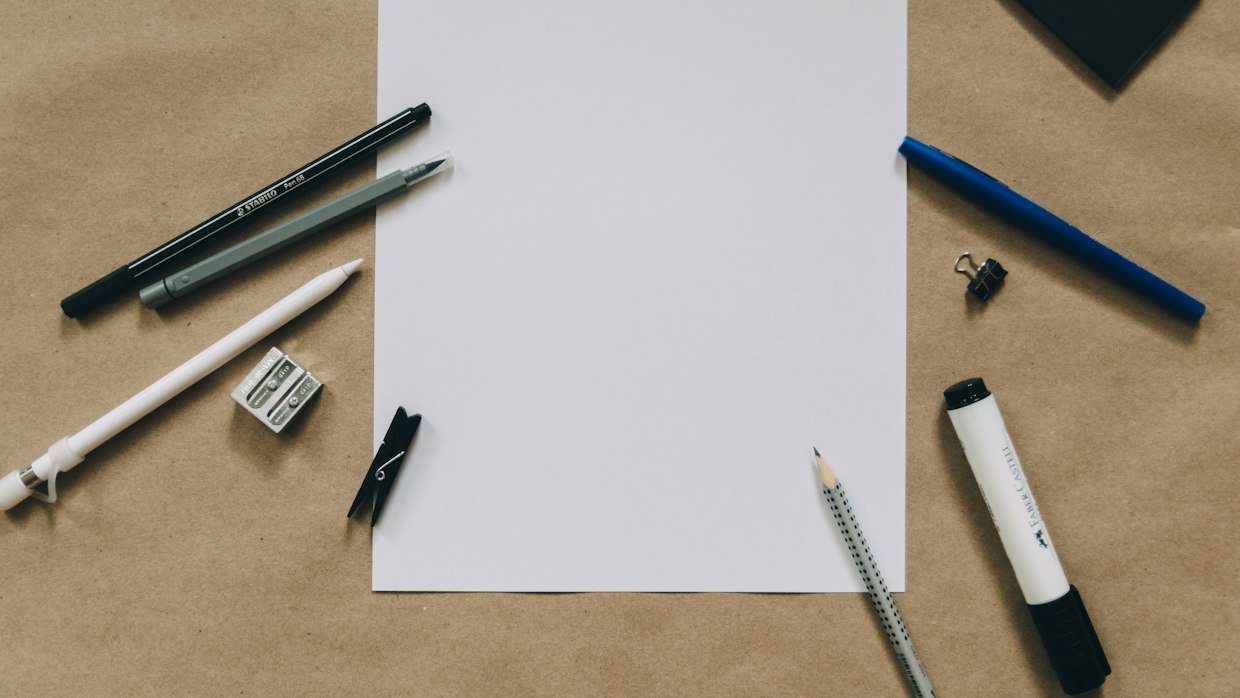A blank index card beside a pencil.
