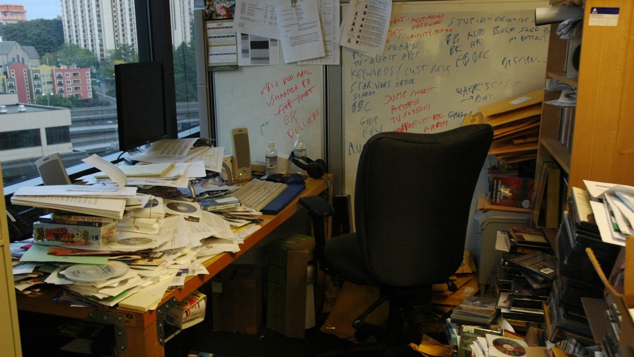 Academic papers sorted into piles.