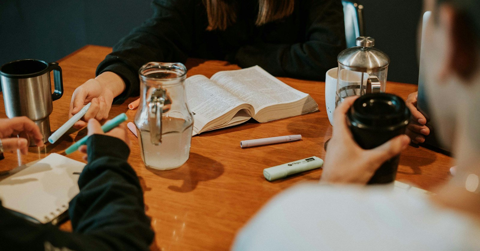 A small team working together around a table.