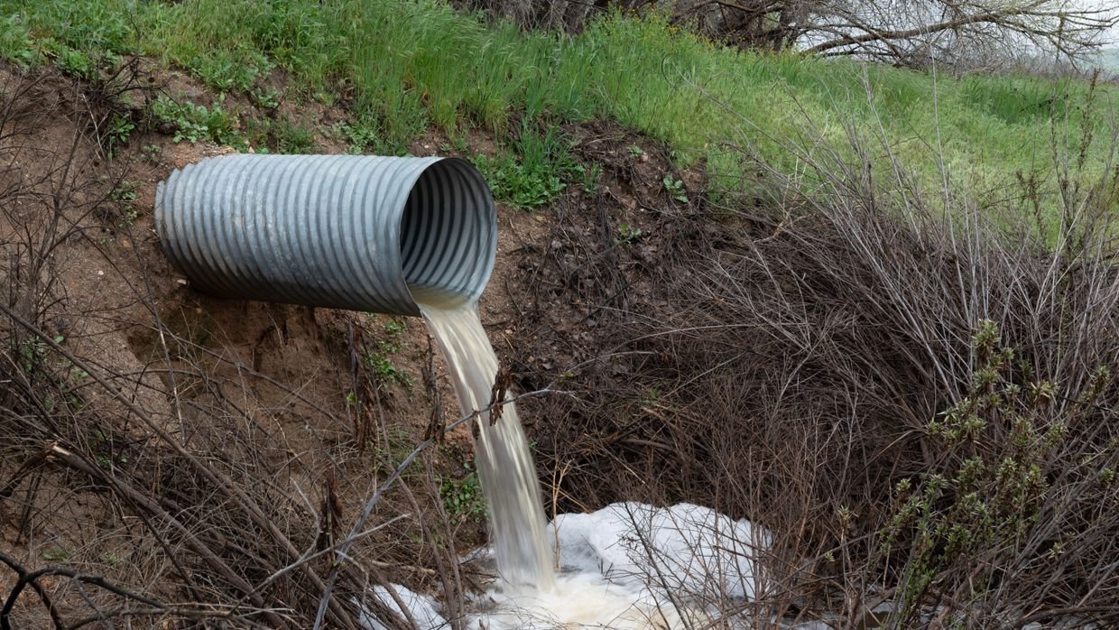 Water flowing from a pipe outlet.