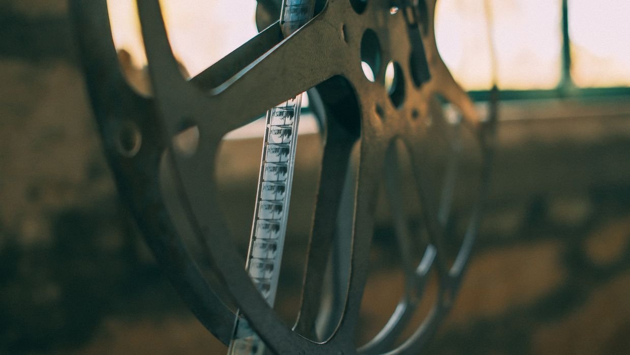 An old film reel lying on a table.