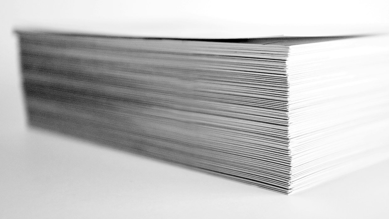 A stack of paper sheets seen edge-on.