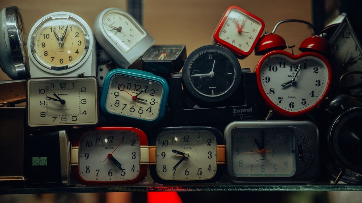 Two clocks showing different times.