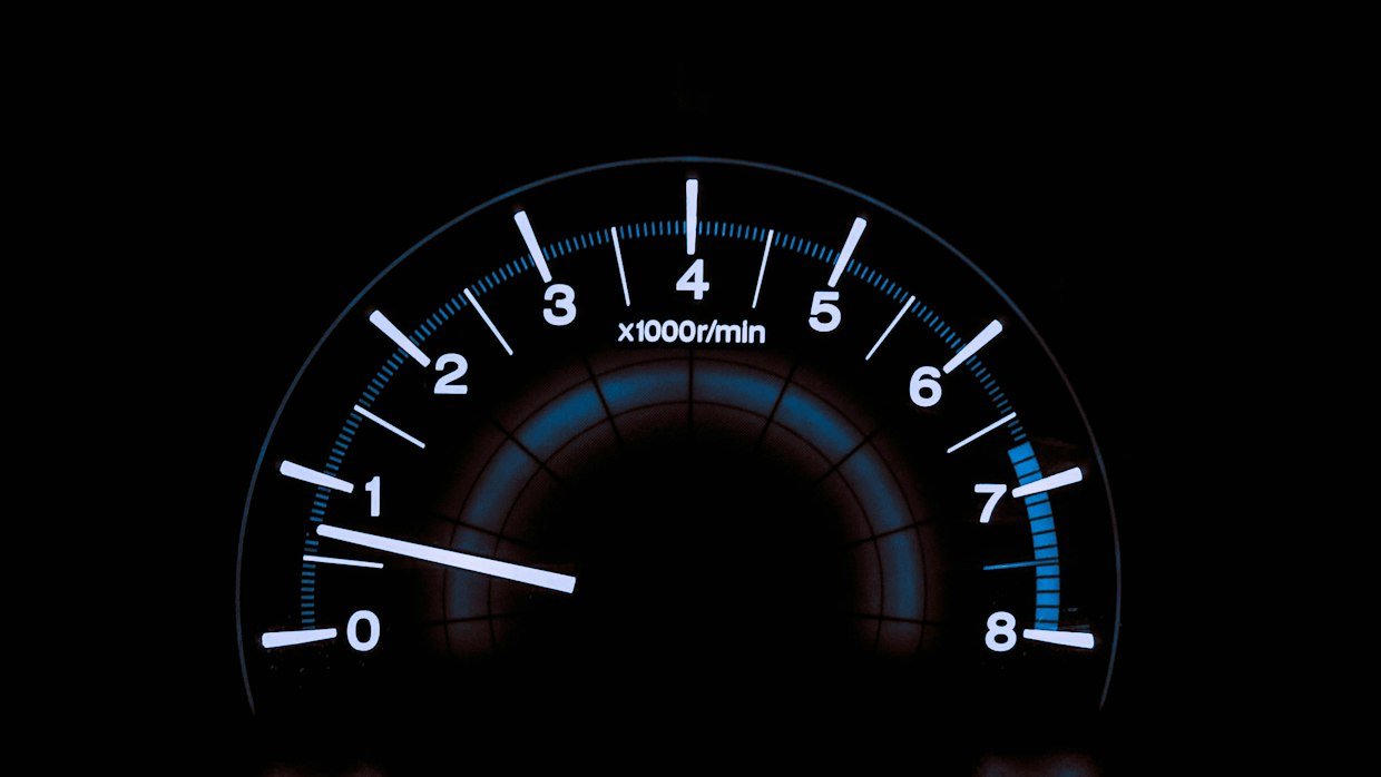 A speedometer needle resting at zero.