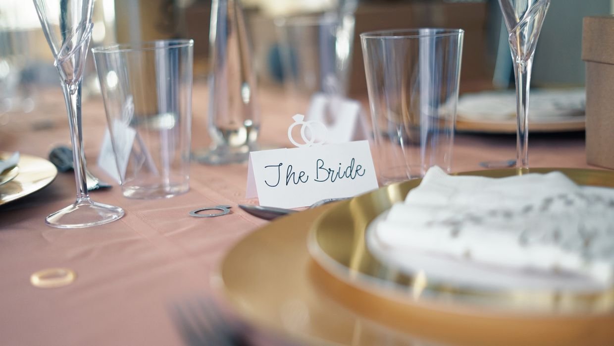 Two blank name plates on a table.
