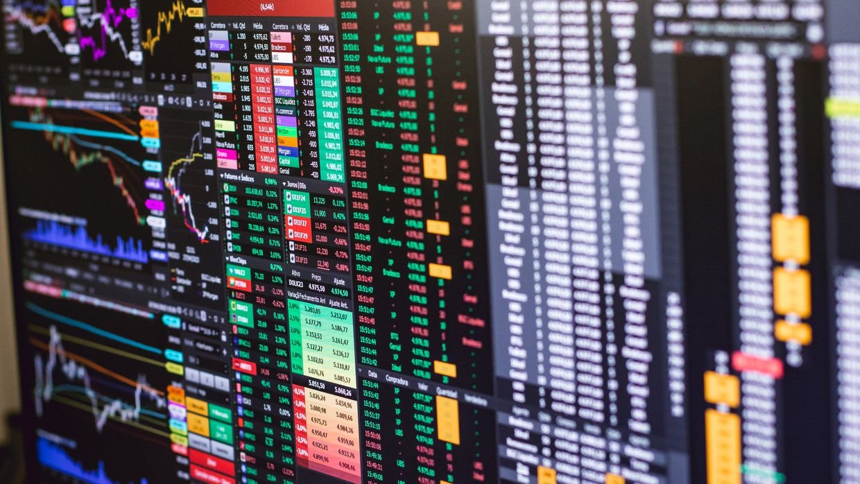A candlestick price chart on screen, the visual evidence a caption-based summary never sees.