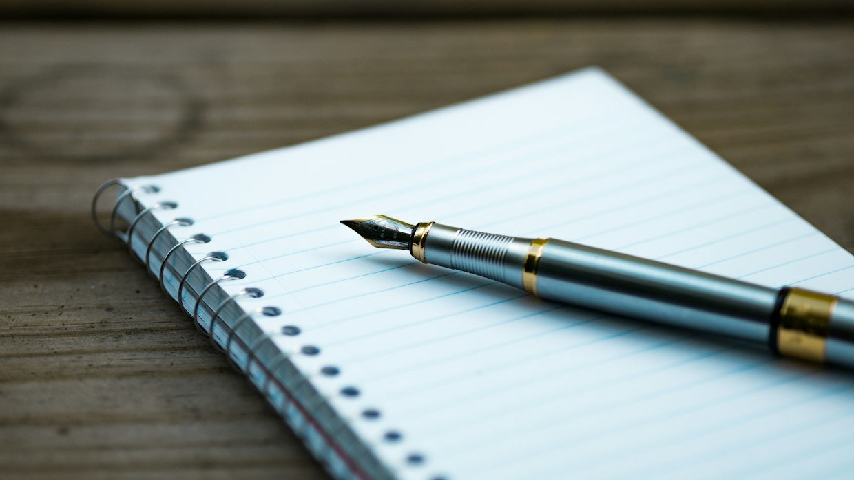 A handwritten list in a notebook, like sorting a video summary into facts, interpretations and predictions.