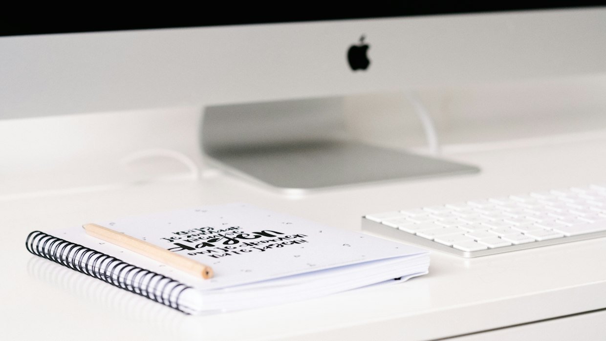 A printed code of conduct lying on a desk.