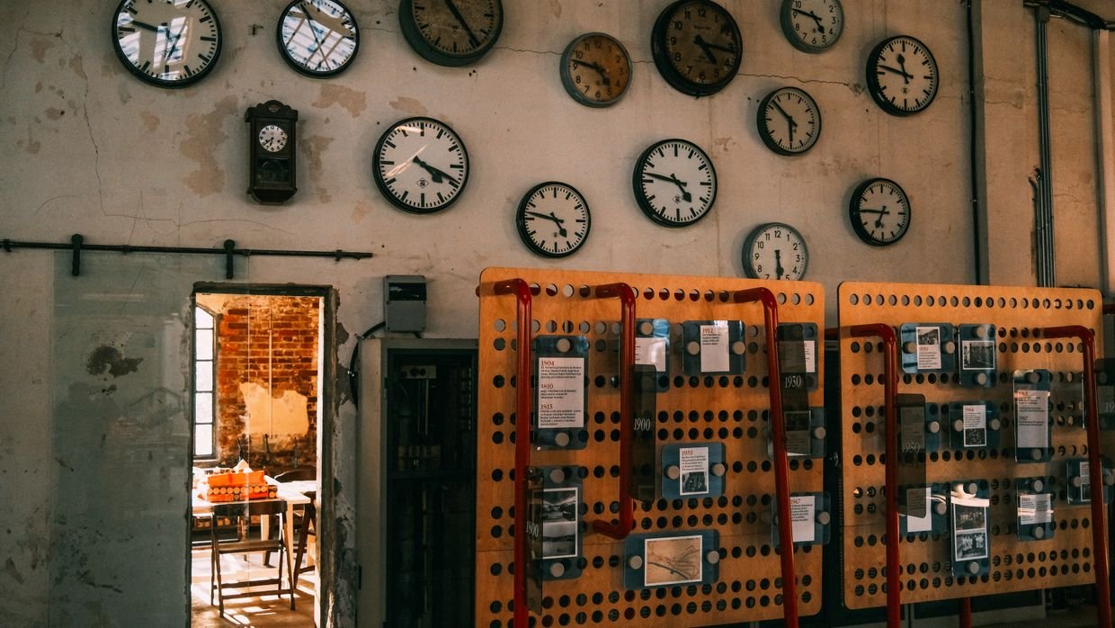 A clock mounted on a newsroom wall.