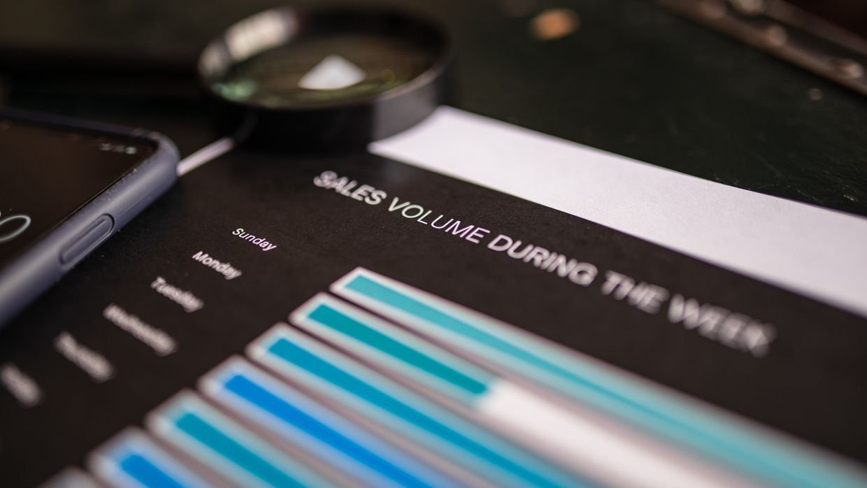 A magnifying glass over a printed document.